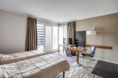 Un ou plusieurs lits dans un hébergement de l'établissement GuestReady - Studio cosy près du métro