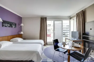 Un ou plusieurs lits dans un hébergement de l'établissement GuestReady - Studio cosy près du métro
