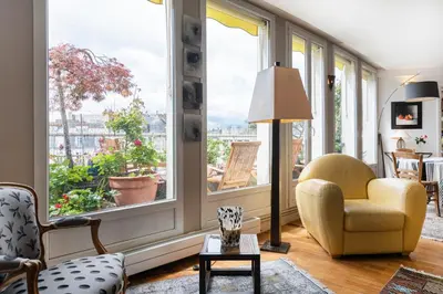 Coin salon dans l'établissement GuestReady - Stunning Apt near Champs Elysées