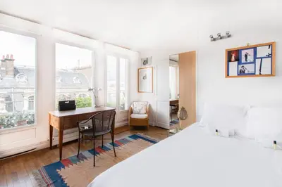 Un ou plusieurs lits dans un hébergement de l'établissement GuestReady - Stunning Apt near Champs Elysées