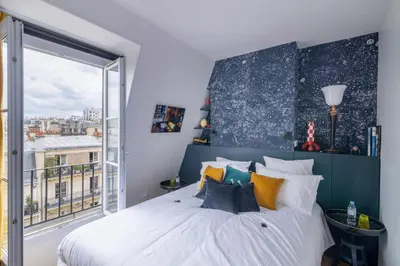 Un ou plusieurs lits dans un hébergement de l'établissement MaisondesChaumes-Paris