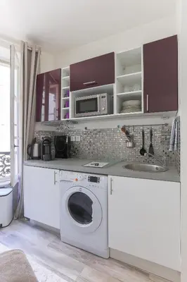 Cuisine ou kitchenette dans l'établissement RASPAIL Cozy Flat