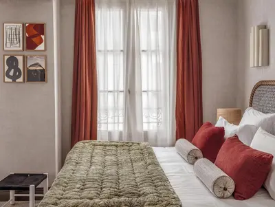 Un ou plusieurs lits dans un hébergement de l'établissement Hôtel Suzie Blue