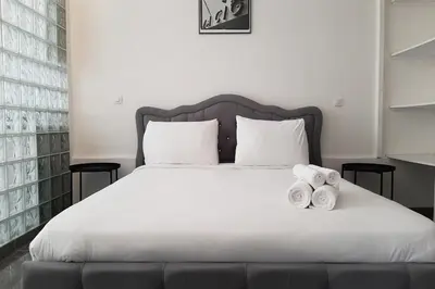 Un ou plusieurs lits dans un hébergement de l'établissement Sweet Apartment in Paris Montmartre