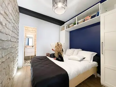 Un ou plusieurs lits dans un hébergement de l'établissement LE GRACIEUX - MILORA INN - Central Paris