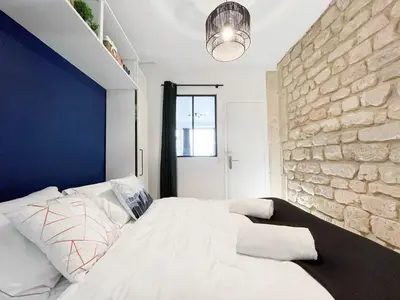 Un ou plusieurs lits dans un hébergement de l'établissement LE GRACIEUX - MILORA INN - Central Paris