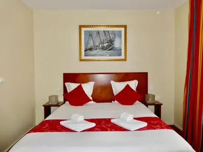 Un ou plusieurs lits dans un hébergement de l'établissement Hotel Bellevue Montmartre