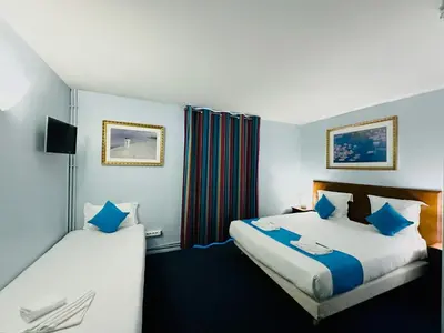 Un ou plusieurs lits dans un hébergement de l'établissement Hotel Bellevue Montmartre