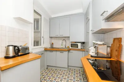 Cuisine ou kitchenette dans l'établissement Beautiful Design Apt In Paris Near The Louvre
