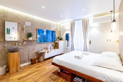 Un ou plusieurs lits dans un hébergement de l'établissement GuestReady - Oasis balinaise au cœur de Paris