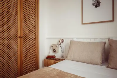 Un ou plusieurs lits dans un hébergement de l'établissement Hôtel Monsieur Aristide