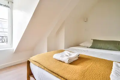 Un ou plusieurs lits dans un hébergement de l'établissement New Cocoon Duplex for 2 in the Heart of Paris (5D)