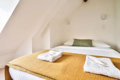 Un ou plusieurs lits dans un hébergement de l'établissement New Cocoon Duplex for 2 in the Heart of Paris (5D)