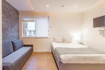 Un ou plusieurs lits dans un hébergement de l'établissement Victor Hugo Flat