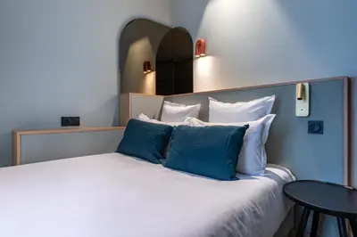 Un ou plusieurs lits dans un hébergement de l'établissement O.Lysée Hotel