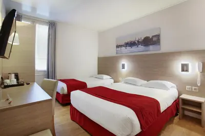 Un ou plusieurs lits dans un hébergement de l'établissement Hôtel LUX PICPUS