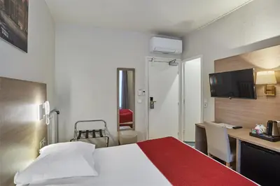 Un ou plusieurs lits dans un hébergement de l'établissement Hôtel LUX PICPUS