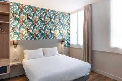 Un ou plusieurs lits dans un hébergement de l'établissement Hôtel 31 - Paris Tour Eiffel