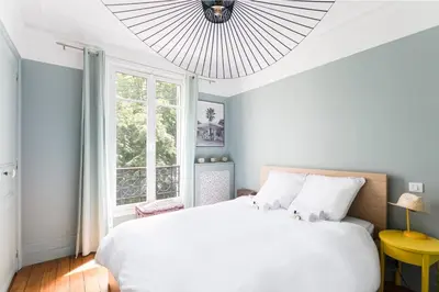 Un ou plusieurs lits dans un hébergement de l'établissement GuestReady - Apt élégant au cœur d'Auteuil