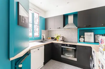 Cuisine ou kitchenette dans l'établissement GuestReady - Apt élégant au cœur d'Auteuil