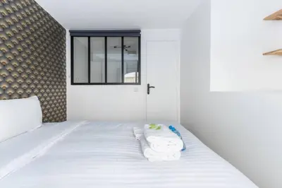 Un ou plusieurs lits dans un hébergement de l'établissement Appartement Duplex de Charme proche de l'opéra Garnier