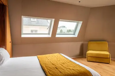 Un ou plusieurs lits dans un hébergement de l'établissement Chateaudun Opéra