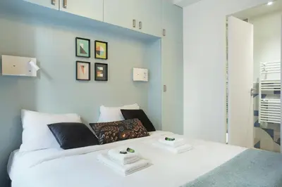 Un ou plusieurs lits dans un hébergement de l'établissement Rent a Room - Aparts CADET