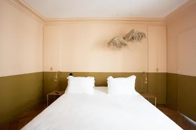 Un ou plusieurs lits dans un hébergement de l'établissement Habitat Parisien - 2BR-2BA - Marais - Centre Pompidou