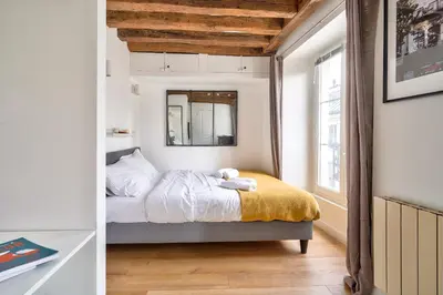 Un ou plusieurs lits dans un hébergement de l'établissement The Perfect Studio in the Heart of Paris (5M)