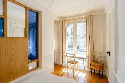 Un ou plusieurs lits dans un hébergement de l'établissement Bel appartement dans le 9ème