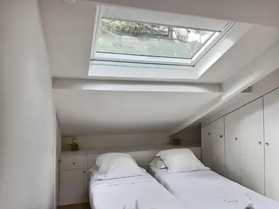 Un ou plusieurs lits dans un hébergement de l'établissement PARISIAN HOME l MARAIS