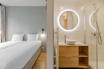 Un ou plusieurs lits dans un hébergement de l'établissement PARISIAN HOME l MARAIS