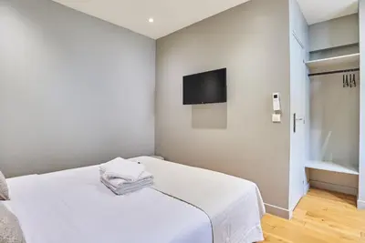 Un ou plusieurs lits dans un hébergement de l'établissement Residence centre de Paris by Studio prestige