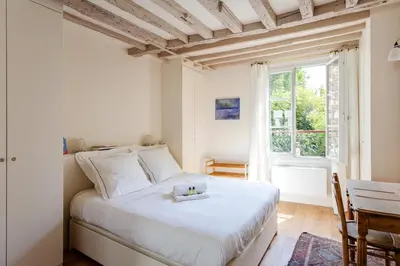 Un ou plusieurs lits dans un hébergement de l'établissement GuestReady - Apt in the heart of Latin Quarter