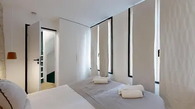 Un ou plusieurs lits dans un hébergement de l'établissement 194 Suite Maison parisienne