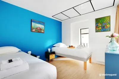 Un ou plusieurs lits dans un hébergement de l'établissement Beautiful apartment- 3BR-10P - Montparnasse