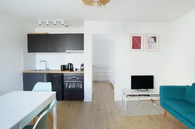 Télévision ou salle de divertissement dans l'établissement Residence Boulogne Centre le passage by Studio prestige