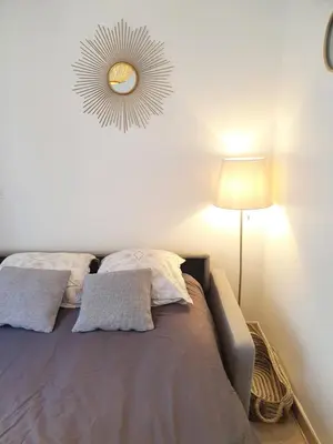 Un ou plusieurs lits dans un hébergement de l'établissement Home Sweet Home Champs Elysées