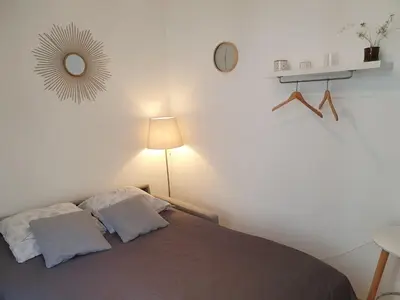 Un ou plusieurs lits dans un hébergement de l'établissement Home Sweet Home Champs Elysées