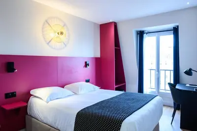 Un ou plusieurs lits dans un hébergement de l'établissement Hôtel D'Alsace