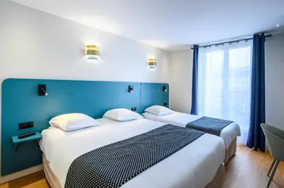 Un ou plusieurs lits dans un hébergement de l'établissement Hôtel D'Alsace