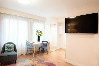 Télévision ou salle de divertissement dans l'établissement CADET Residence