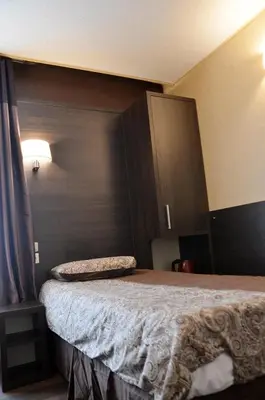 Un ou plusieurs lits dans un hébergement de l'établissement Hôtel du Parc