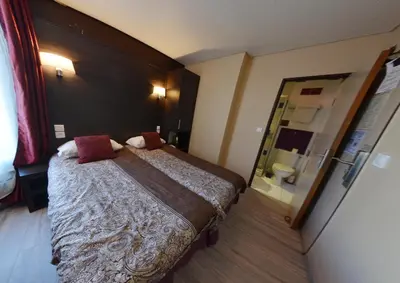 Un ou plusieurs lits dans un hébergement de l'établissement Hôtel du Parc