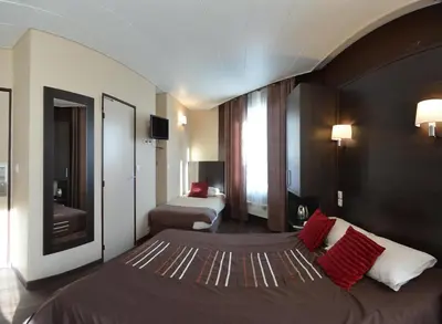 Un ou plusieurs lits dans un hébergement de l'établissement Hôtel du Parc
