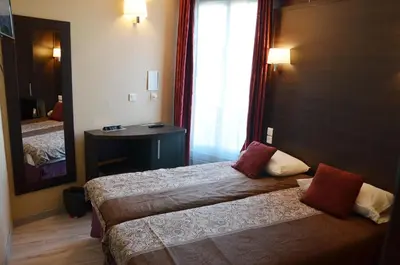 Un ou plusieurs lits dans un hébergement de l'établissement Hôtel du Parc