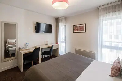 Un ou plusieurs lits dans un hébergement de l'établissement Appart’City Confort Paris Villejuif