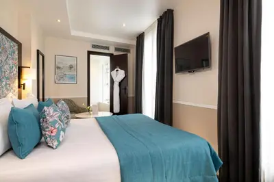 Un ou plusieurs lits dans un hébergement de l'établissement Hotel Park Lane Paris
