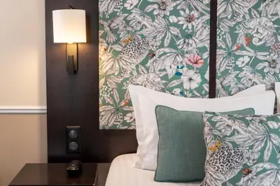 Un ou plusieurs lits dans un hébergement de l'établissement Hotel Park Lane Paris