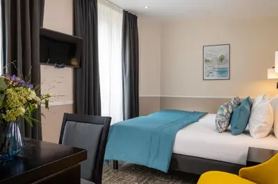 Un ou plusieurs lits dans un hébergement de l'établissement Hotel Park Lane Paris